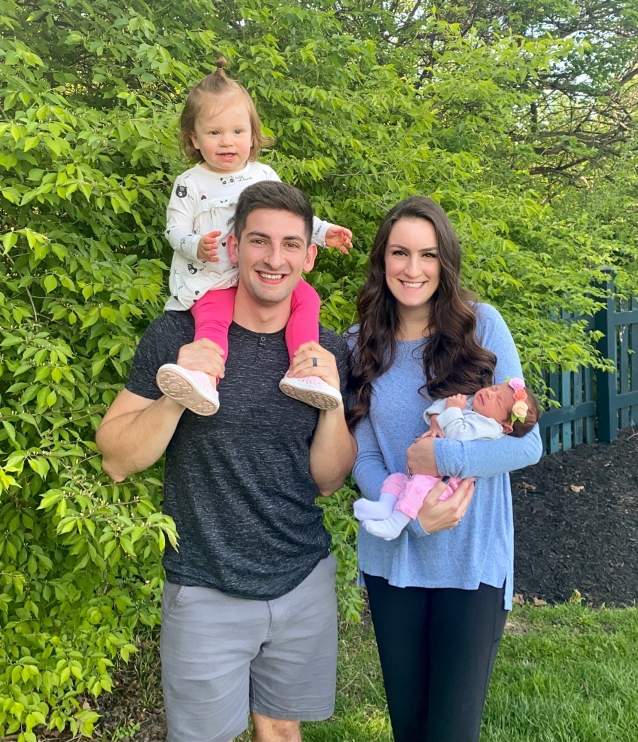 mom and dad holding babies